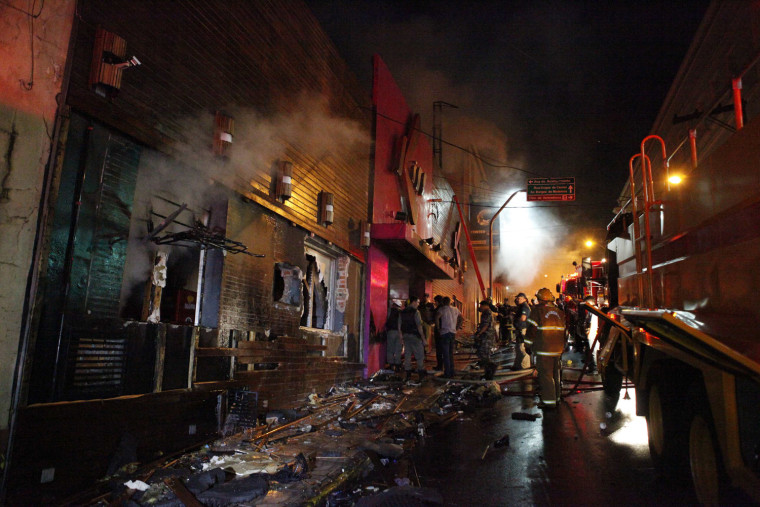 Firefighters try to extinguish a fire at Kiss nightclub in the southern city of Santa Maria, Brazil.