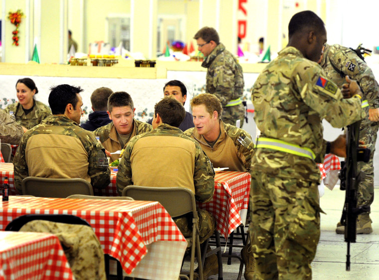 Prince Harry sits with his fellow troops in the dining hall at Camp Bastion. A British pool report said Prince Harry and his squad were known to swap Kit Kats and Rice Krispies Squares for candy from the American soldiers, with M&Ms at the top of the list.