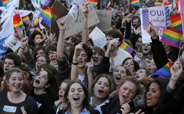 Demonstrators march through the streets of Paris in support of the French government's draft law to legalize marriage and adoption for same-sex couples, Jan. 27.
