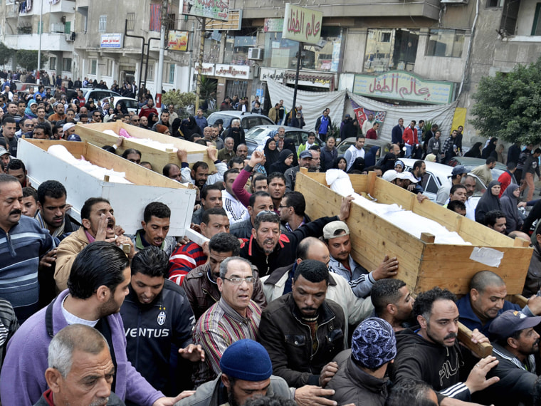 Egyptians carry the coffins of the previous day's violence in Port Said, Egypt, on Jan. 28.