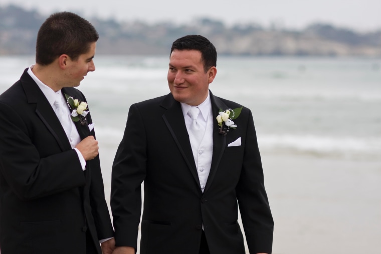 Carlo Joyce, right, and Thomas Joyce share a moment on their wedding day on July 10, 2010.