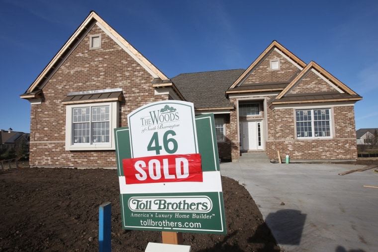 Work is being finished on a home which was sold in a Toll Brothers housing development on December 4, 2012 in South Barrington, Illinois. U.S. single-...