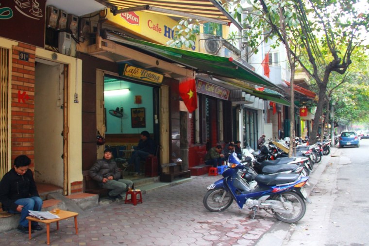 In this photo taken Jan. 5, 2013, customers drink coffee on Trieu Viet Vuong Street in Hanoi, Vietnam. Dunkin Donuts said Wednesday it plans to expan...