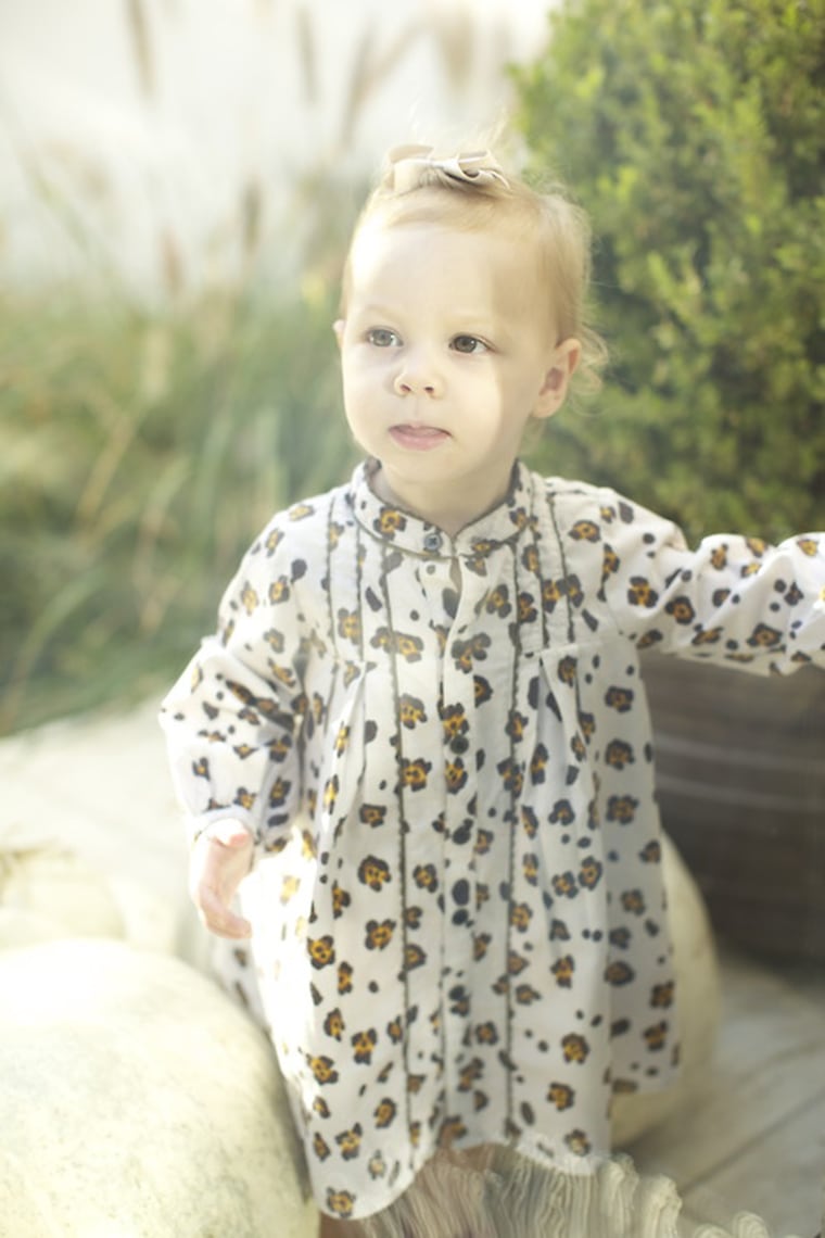 One cool baby wears a leopard-print onesie by Trico Field.