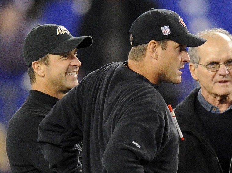 Baltimore Ravens head coach John Harbaugh, left, chats with his brother, San Francisco 49ers head coach Jim Harbaugh, center, and their father, Jack, ...