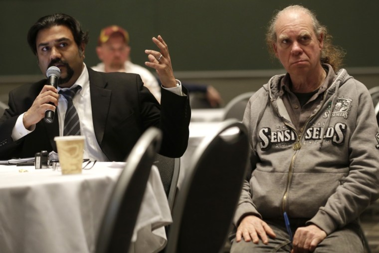 Khurshid Khoja, left, an attorney with San Francisco based Greenbridge Corporate Counsel, asks a question as he sits with marijuana cultivation expert...