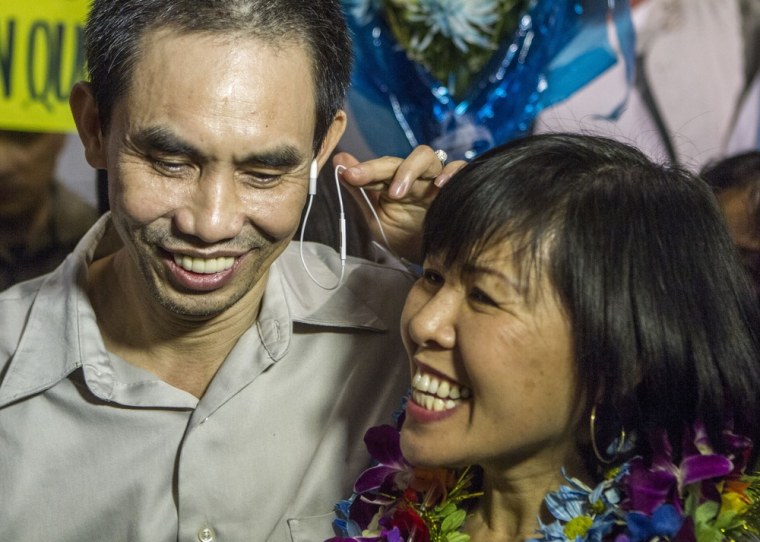 Nguyen Quoc Quan and his wife Huong Mai Ngo smile during a news conference after his arrival in Los Angeles on Jan. 30, 2013.