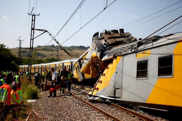 Paramedics tend to some of the people injured when two trains collided near Pretoria, South Africa, on Thursday.