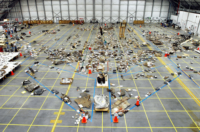 Pieces of Columbia space shuttle debris are seen stored in a hangar at NASA's Kennedy Space Center in Florida during accident investigation in 2003. More than 82,000 pieces of debris from the Feb. 1, 2003 shuttle disaster, which killed seven astronauts, were recovered. In all, 84,800 pounds, or 38 percent of the total dry weight of Columbia, was recovered.