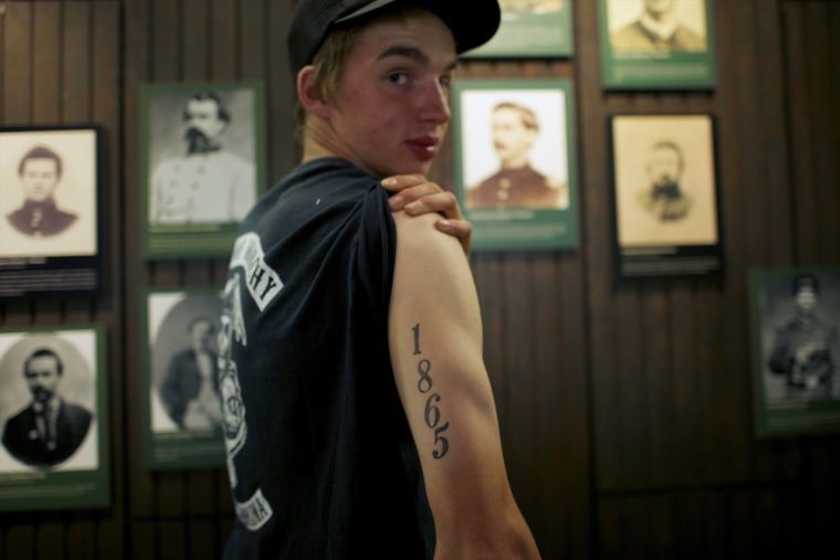 \"My granddaddy had a CSA (Confederate States of America) tattoo, mine are 1861 and 1865.\" said T.J. Miller, 18, a Confederate 13th North Carolina Company B 'hardcore.' \"It's a history that's dying and I want to be that young kid that keeps it going,\"