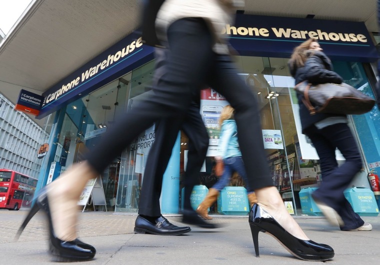 Pedestrians walk past the Carphone Warehouse store on Oxford Street in central London April 30, 2013. U.S. retailer Best Buy Co Inc retreated from its...