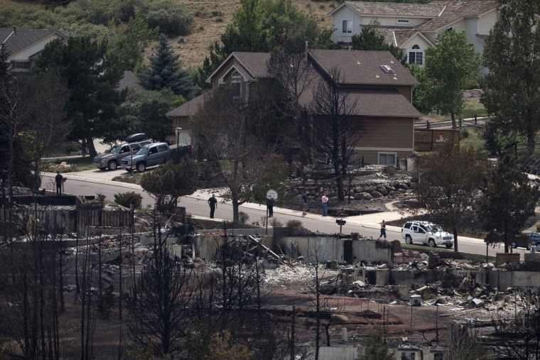 July 1, 2012: Homes destroyed by the Waldo Canyon Fire in the Mountain Shadows neighborhood of Colorado Springs. Residents began returning to charred areas of Colorado Springs after the most destructive wildfire in Colorado history forced tens of thousands of people from their homes and left the landscape a blackened wasteland.