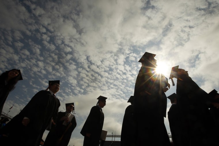 Graduating students arrive for Commencement Exercises at Boston College in Boston, Massachusetts May 20, 2013.