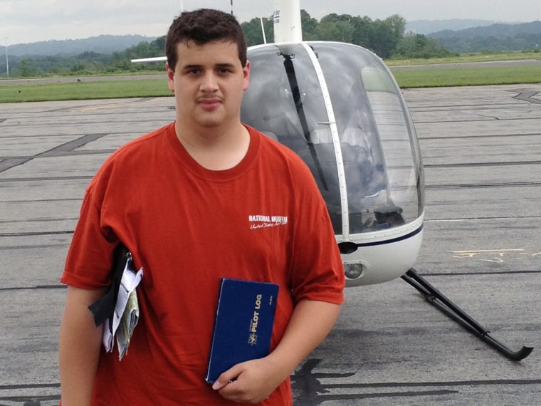 Image: Robert Pinksten in front of helicopter