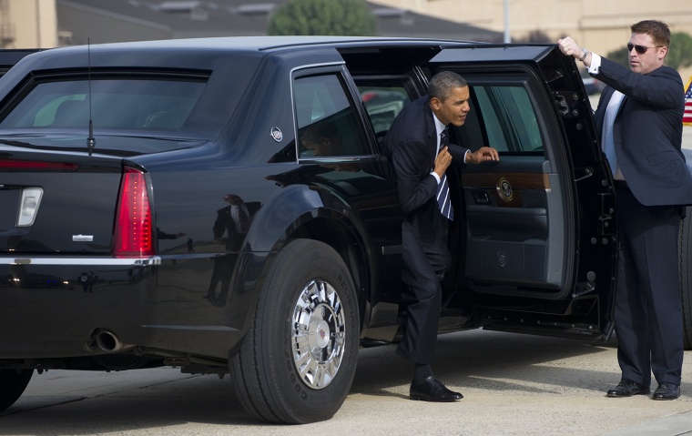 US President Barack Obama gets out of his limousine as he walks to Air Force One prior to departure from Andrews Air Force Base in Maryland, October 1...