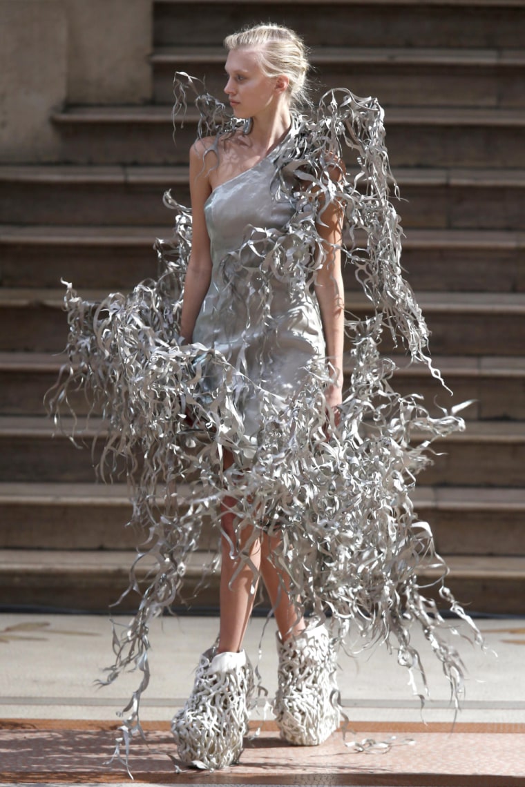 A model presents a creation by designer Iris van Herpen on July 1, 2013.