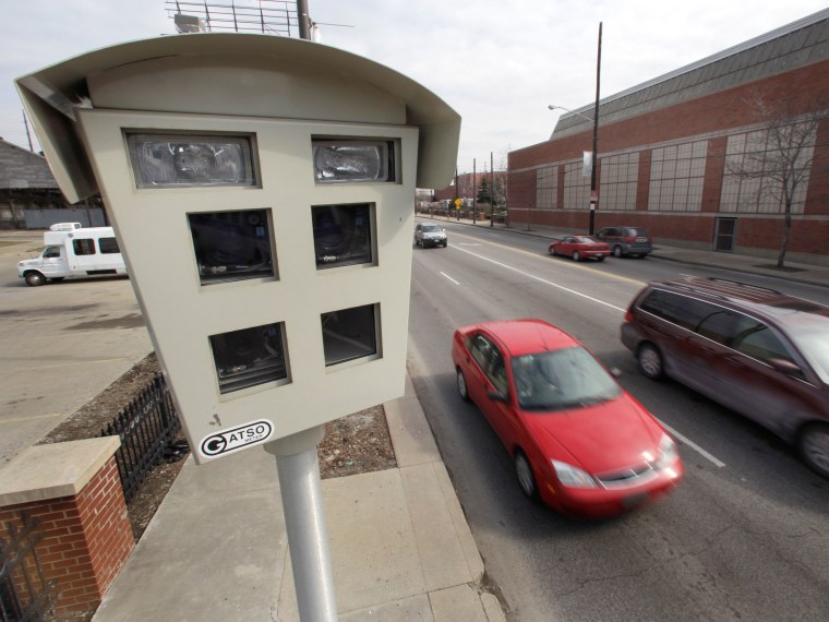 ** ADVANCE FOR SUNDAY, MARCH 22 **Vehicles drive past a speed surveillance and ticketing camera on a road heading into downtown in Cleveland, Ohio on ...