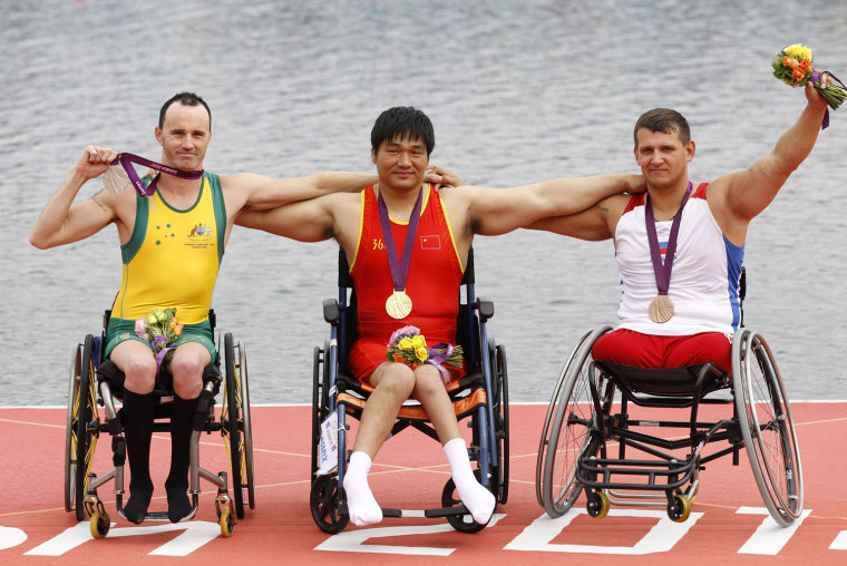Russian Paralympic bronze medalist Aleksey Chuvashev (far right) will be part of the group of torchbearers leading up to Sochi in February of 2014.
