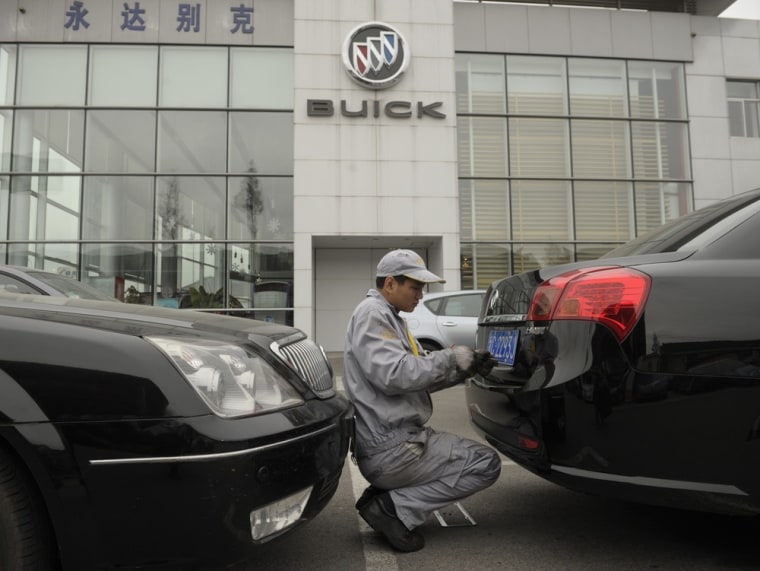 A mechanic works on a Buick at a General Motors dealership in Shanghai in 2011. China is now General Motors' biggest market, selling more vehicles tha...
