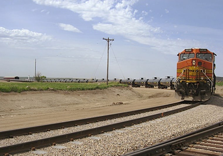 FILE - In this June 5, 2012, file photo provided by Rangeland Energy, LLC, a train leaves the company's crude oil loading terminal near Epping, ND. Th...