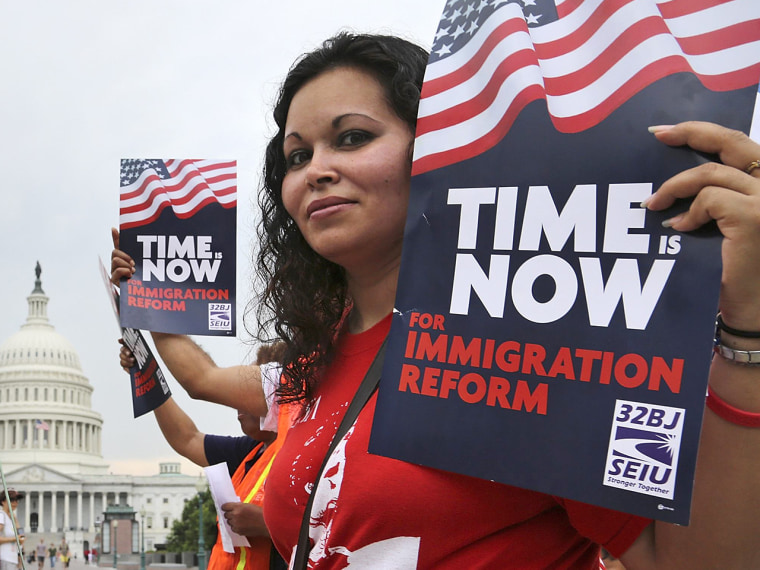 A group of immigrants and activists for immigration reform, led by Service Employees International Union (SEIU) and CASA, chant as they march to urge congress to act on immigration reform, on Capitol Hill, June 26, 2013.