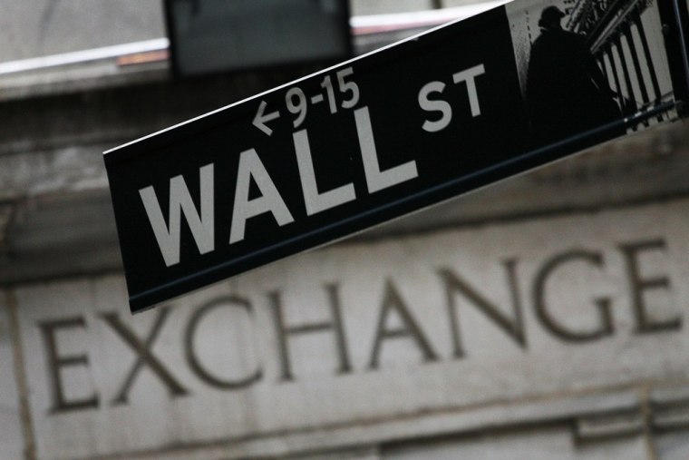 In this Sept. 30, 2008 file photo, a Wall St. sign hangs in front of the New York Stock Exchange.