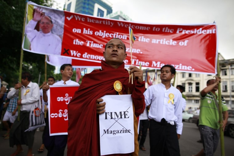 A Buddhist monk and other protesters demonstrate against TIME magazine in Yangon, Myanmar, on June 30.