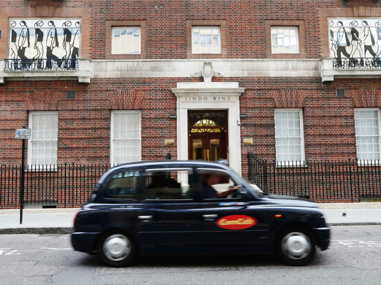 A taxi passes the Lindo Wing of St Mary's Hospital where Catherine, Duchess of Cambridge is due to give birth in London, June 19, 2013. Britain's Duch...