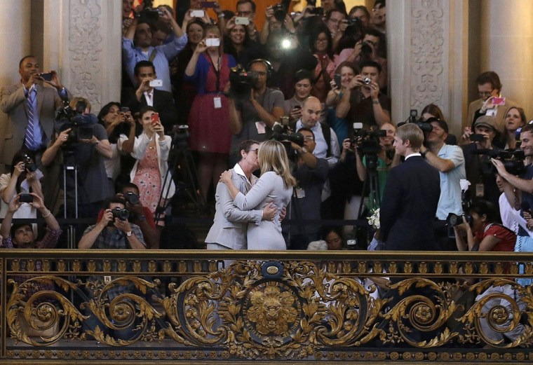 Kris Perry, foreground left, kisses Sandy Stier as they are married at City Hall in San Francisco on June 28.