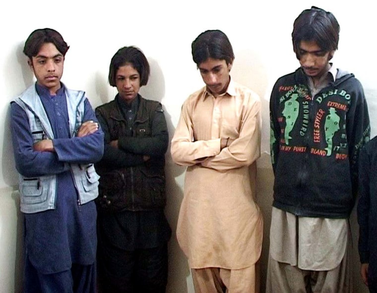 14-year-old Sabir, far right, and other boys are paraded in front of the media by police in the Pakistani city of Quetta after they were arrested on suspicion of taking part in attempted bomb attacks.
