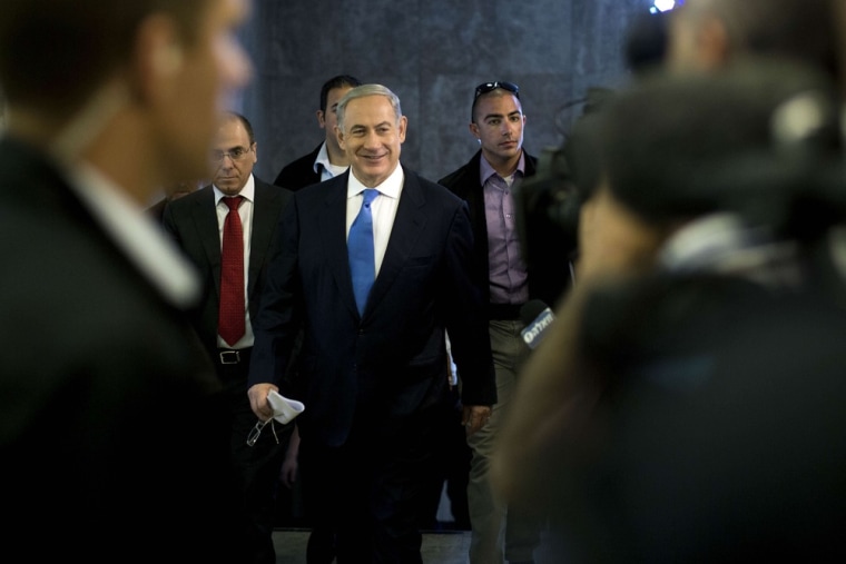Israeli Prime Minister Benjamin Netanyahu smiles as he arrives for the weekly cabinet meeting in his Jerusalem office on Sunday.