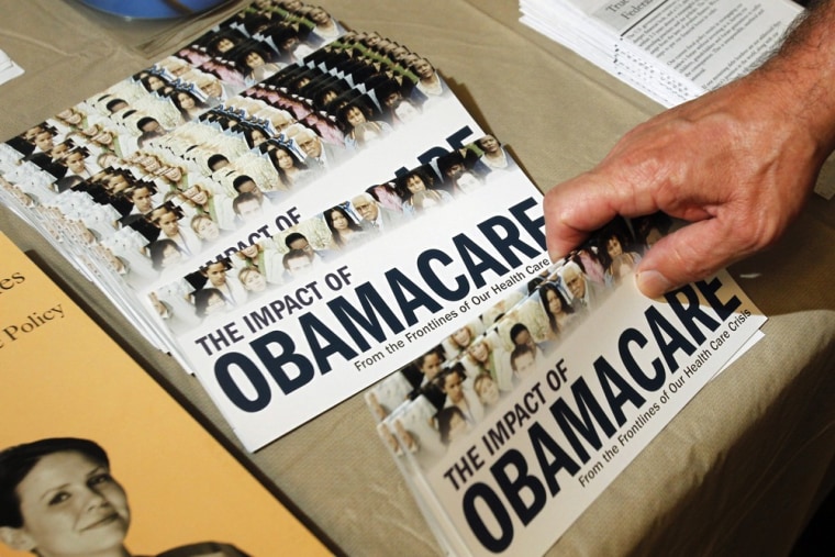 This 2012 file photo shows campaign material about Obamacare, seen at a Tea Party rally in New Hampshire.
