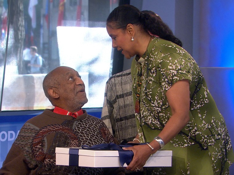 Actress Phylicia Rashad presents a special gift to her former co-star, Bill Cosby.