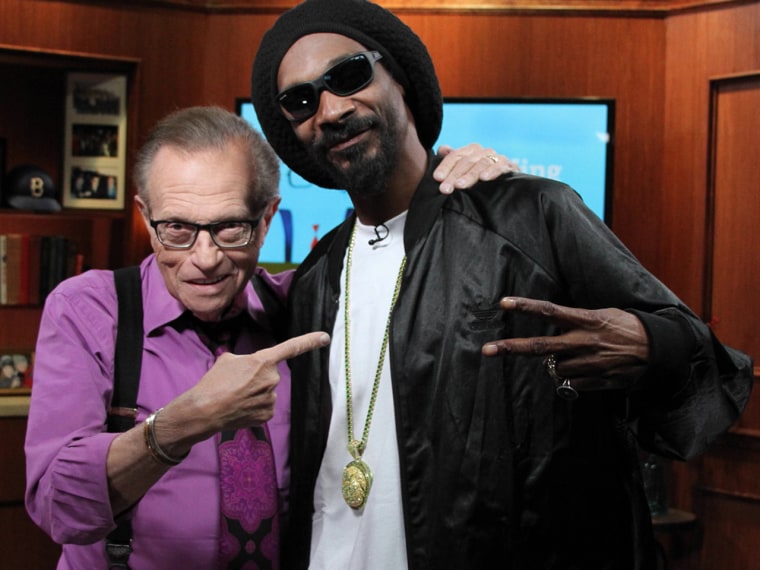 Larry King poses with Snoop Lion, a guest on his \"Larry King Now\" show.