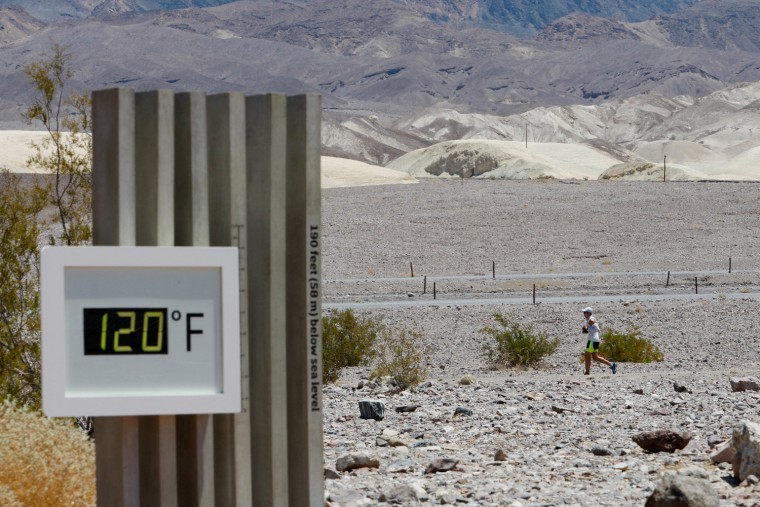 A competitor passes the unofficial thermometer at Furnace Creek Visitor Center during the AdventurCORPS Badwater 135 ultra-marathon race on July 15, 2013 in Death Valley National Park, Calif.