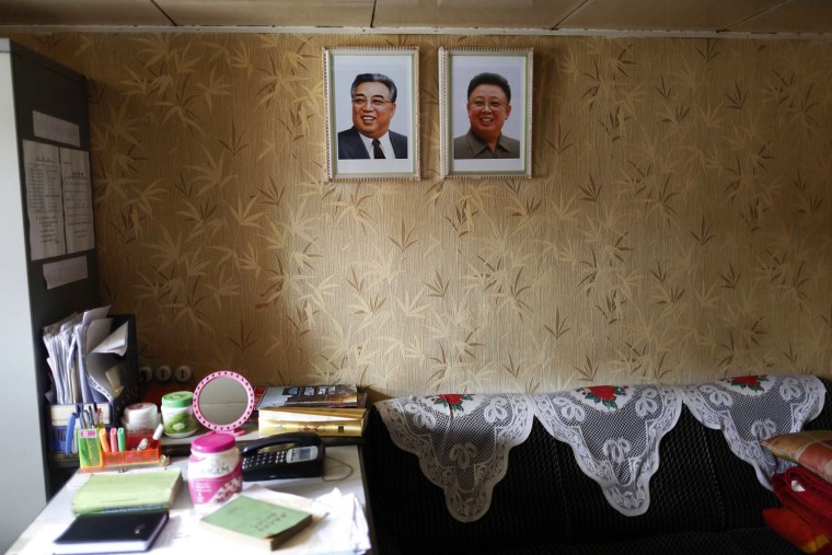 Portraits of former leaders Kim Jong Il (right) and Kim Il Sung are seen in one of the rooms aboard the North Korean-flagged Chong Chon Gang after it docked in Colon City, Panama, on Tuesday.