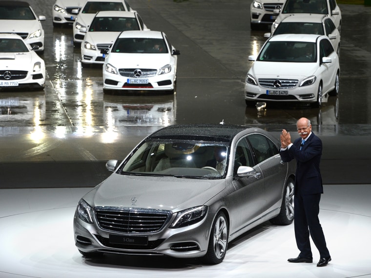 CEO of Daimler Dieter Zetsche stands next to the new S-Class Mercedes presented in Hamburg, Germany, Wednesday, May 15, 2013. The new Mercedes is supp...