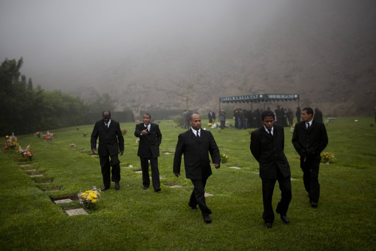 Black pallbearers leave the cemetery after carrying the coffin for a burial in Lima, Peru, on June 21, 2013. In 2009 the government of then-President Alan Garcia issued a public apology to Afro-Peruvians for a racist tradition of colonial slavery - largely in cane fields - for which they never received reparations. A year later, his government suggested Lima funeral homes stop employing blacks exclusively as pallbearers.
