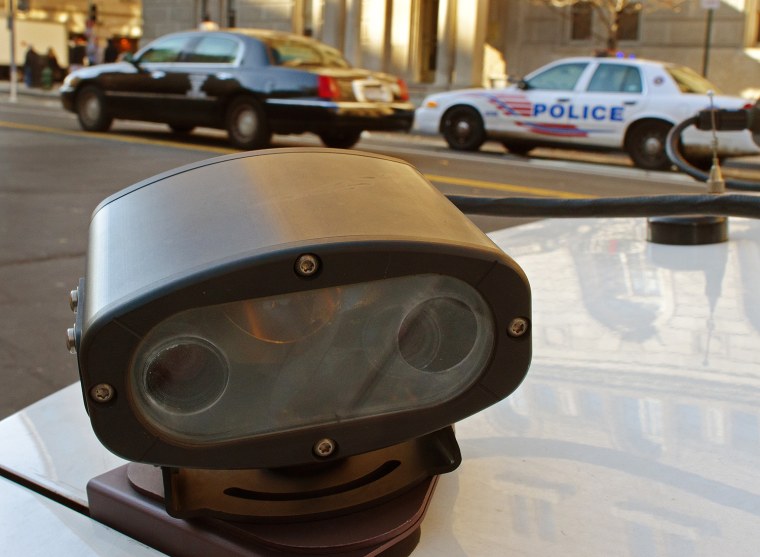 A license plate reader sits on the trunk of a Metropolitan Police Department car in Washington, D.C, in 2011. The device records automobile license plates that drive by and then rapidly checks a computer database of stolen or wanted cars.