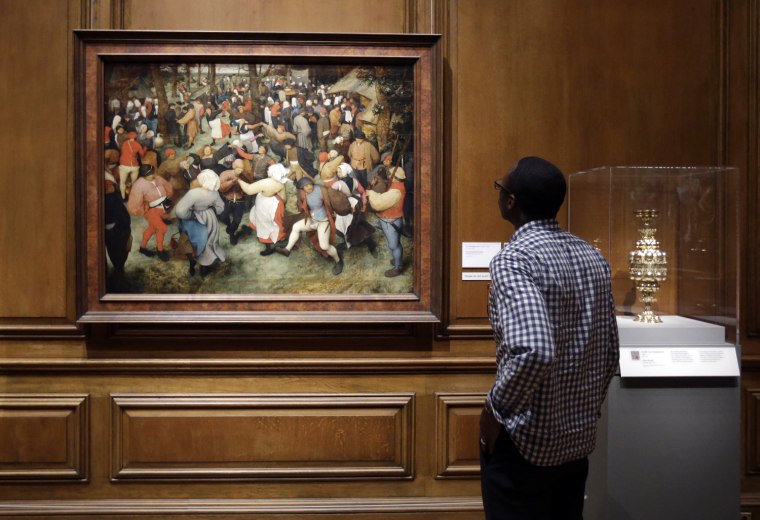 In a June 13, 2013 photo, The Wedding Dance by Pieter Bruegel the Elder is displayed at the Detroit Institute of Arts in Detroit.