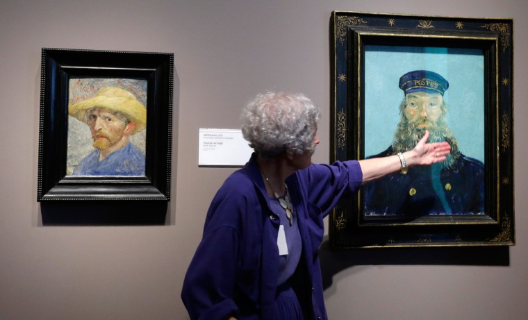 In a June 13, 2013 photo, Detroit Institute of Arts docent Lea Schelke points out details in the Portrait of Postman Roulin by Van Gogh.