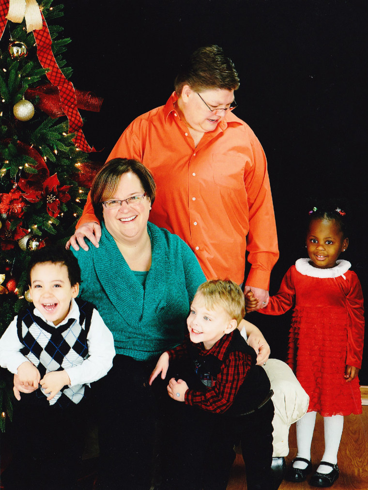 April DeBoer and Jane Rowse with their adopted children (from l-r) Nolan, Jacob and Ryanne.