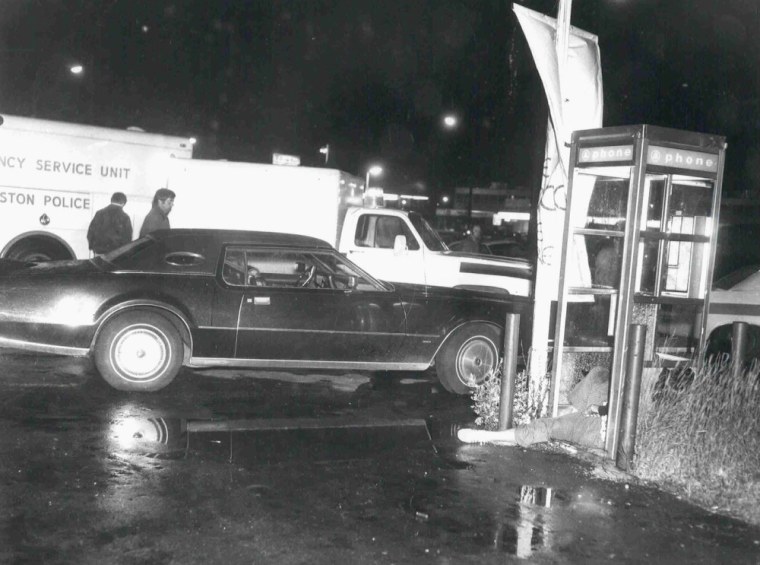 Bar owner Eddie Connors' body is shown lying in a phone booth after a 1975 shooting allegedly carried out by James