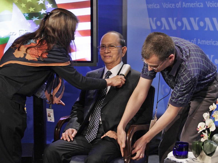 Voice of America staff are seen with Myanmar President Thein Sein before a town hall event at the Voice of America headquarters in Washington on May 20. Voice of America is the largest and oldest network of the Broadcasting Board of Governors, which will now be allowed in U.S. markets.