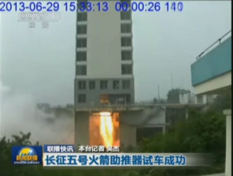 This still from China's state-run media shows the test of China's Long March 5 rocket engine on June 29, 2013. The new rocket will launch from China's Hainan Island launch complex and be used to help build a new space station in orbit.