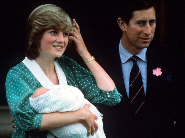 Prince Charles and Princess Diana pose with their newborn son Prince William on the steps of St Mary's Hospital in London, June 1982.
