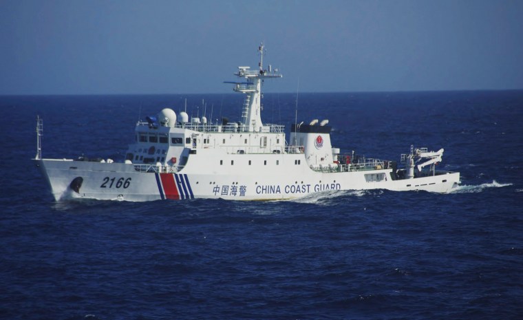 In this Wednesday photo released by Japan's Coast Guard, a China Coast Guard vessel sails in waters 41 miles from the disputed East China Sea islands.