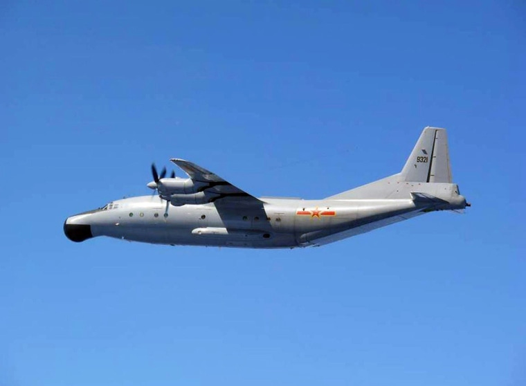 A handout picture from the Japanese Defense Ministry which it says was taken on Wednesday and shows a Chinese military plane flying over international waters close to the disputed East China Sea islands.
