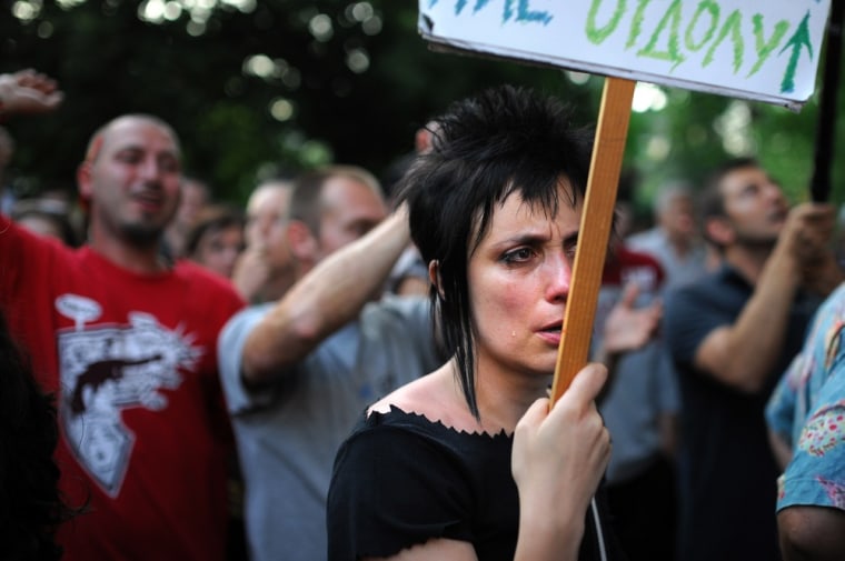 A woman takes part in an anti-government protest in Sofia on July 23. Several thousand protesters cordoned off the parliament building early on Tuesday evening, preventing 109 ministers, lawmakers and other officials from leaving after budget revision discussions.