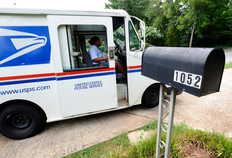 epa03330123 United States Postal Service letter carrier Letonya Lawson makes her deliveries in Avondale Estates, Georgia USA, 31 July 2012. The U.S. P...